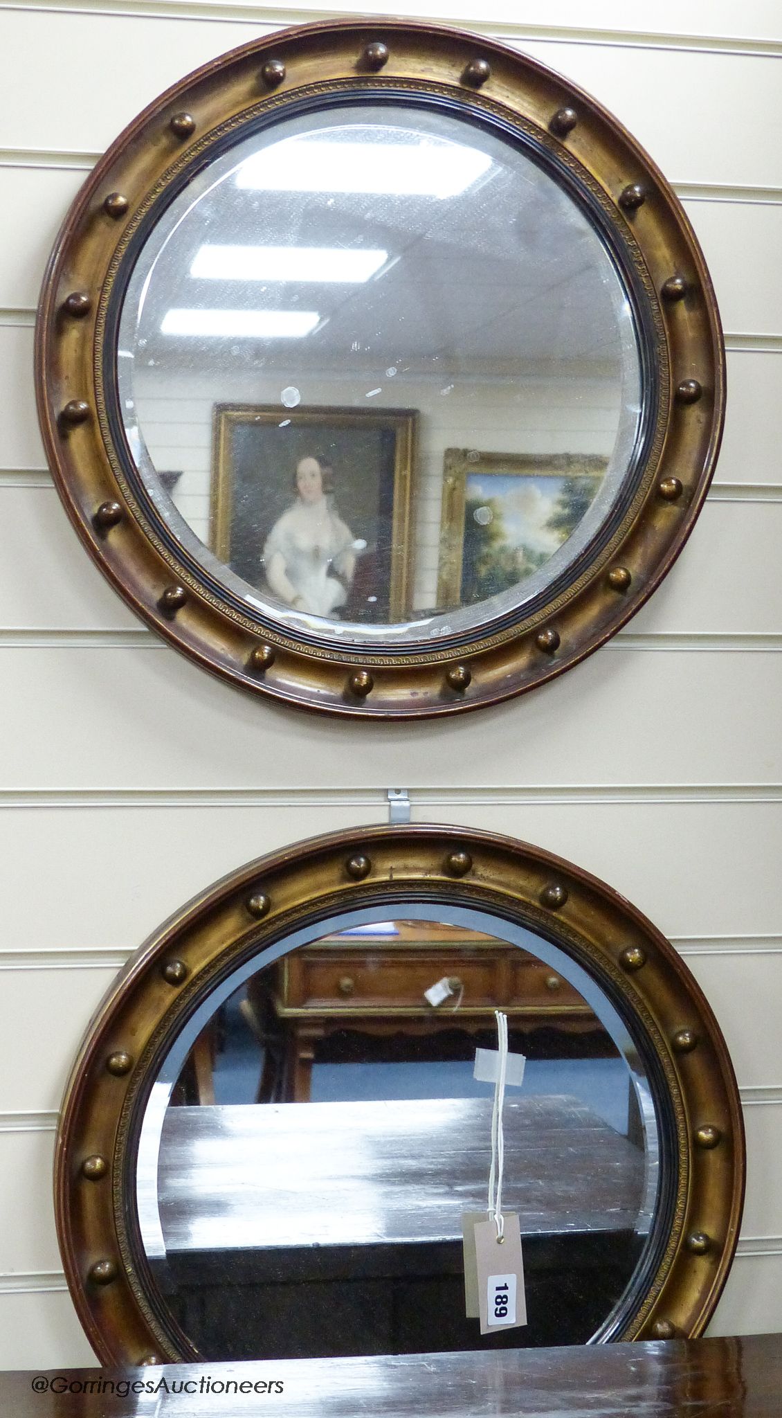 A pair Regency style circular wall mirrors, 44 cm diameter